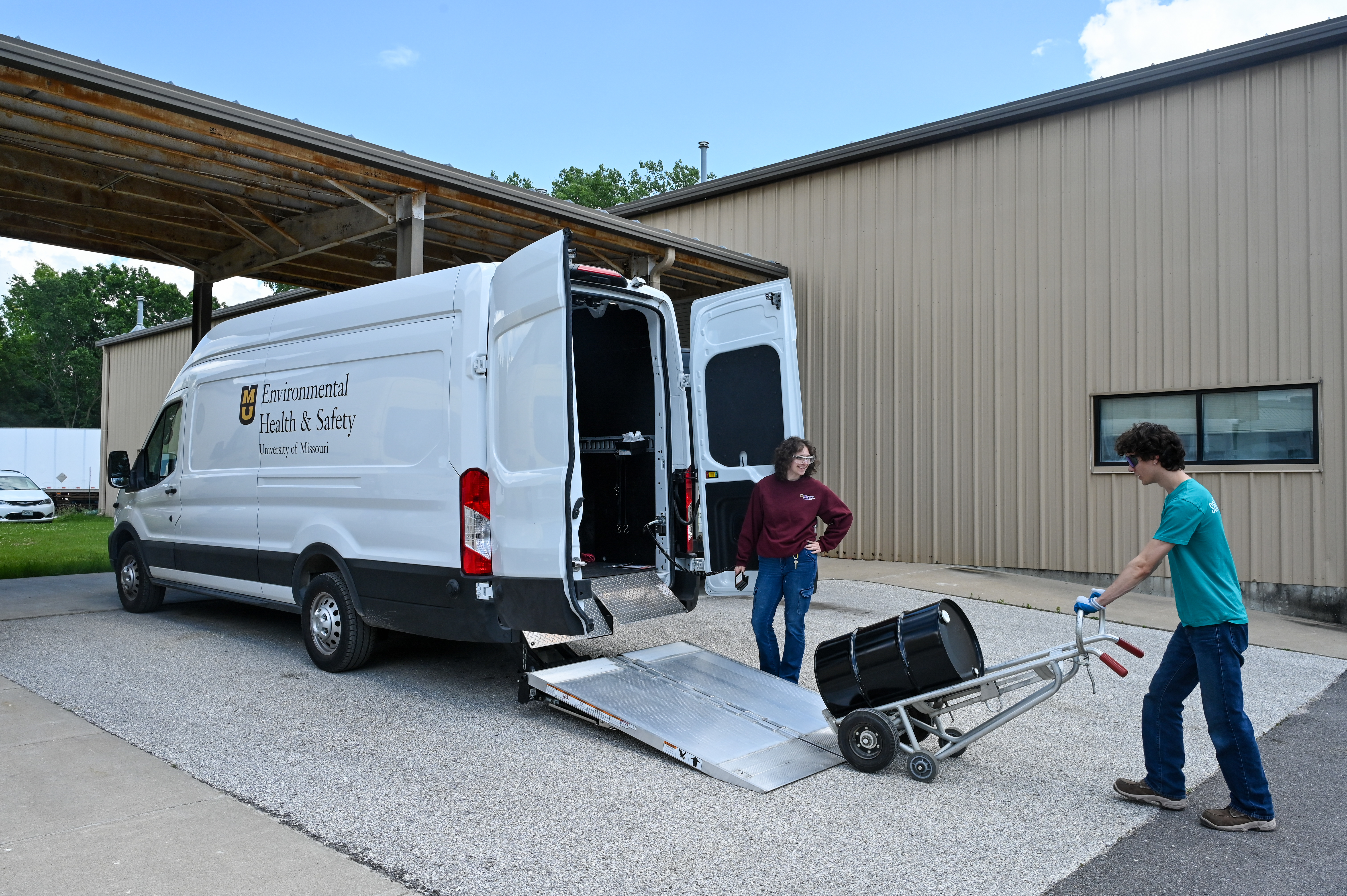 EHS technicians loading drums